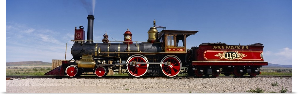 Panoramic photograph of vintage train car on railway.