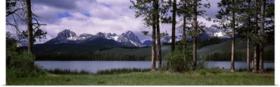 Trees at the lakeside with mountains in the background Little Redfish Lake Sawtooth National Recreation Area Custer County Idaho