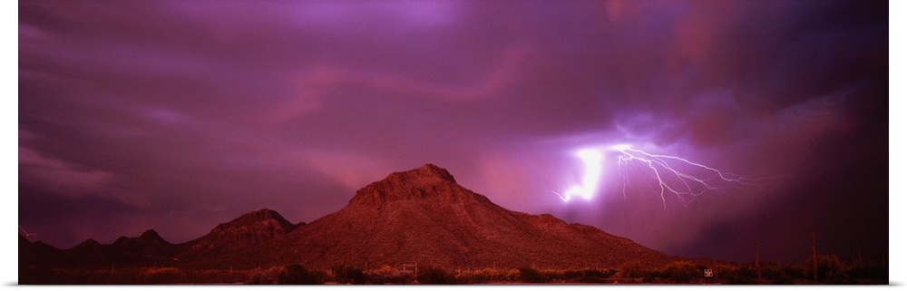 Stunning panoramic photograph of a lightning strike over the mountains in Tucson, Arizona.
