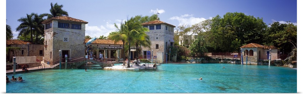 The large public Venetian pool in Florida is photographed in panoramic view.