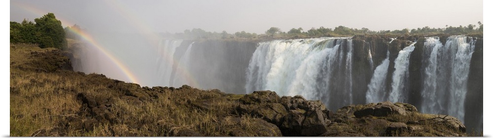 Victoria Falls with rainbow in the mist, Zambezi River, Zimbabwe.