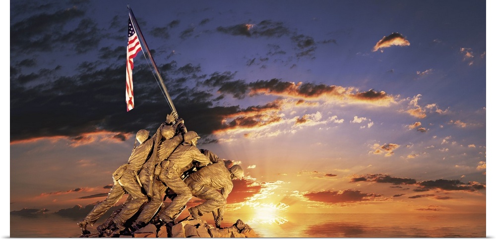 Composite image of a statue of American soldiers raising a flag on a rocky mount and the sun setting on the ocean's horizon.