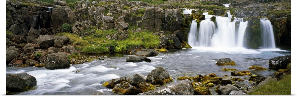 Waterfall on rocky stream, Iceland