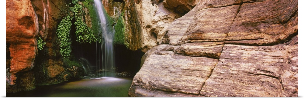 Waterfall rushing through Redwall Cavern, Grand Canyon National Park, Arizona