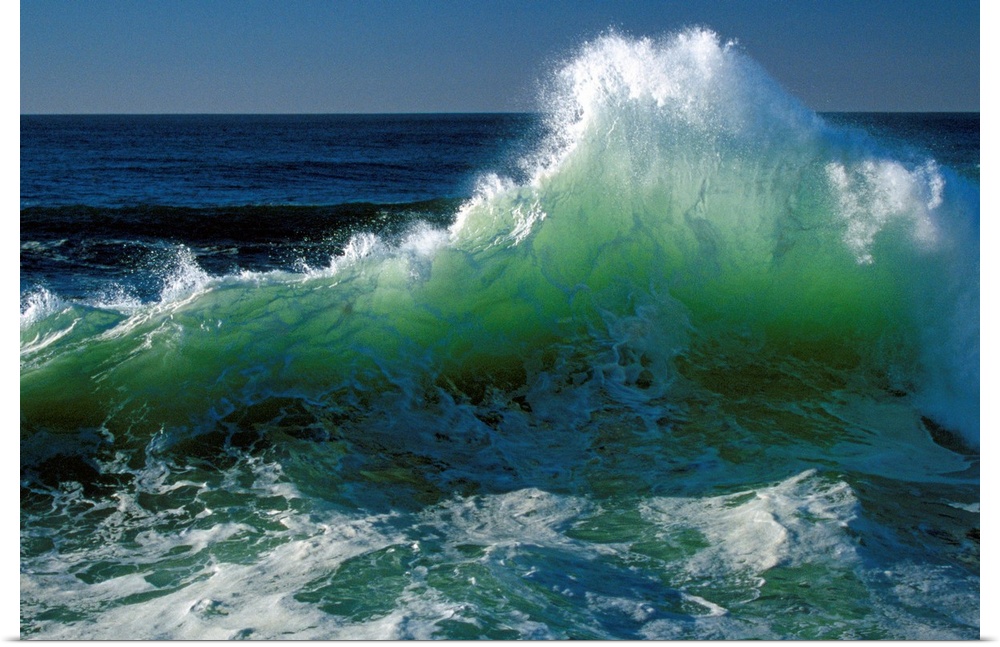 This wall art for the office or home is a landscape photograph of a wave breaking near the shore.