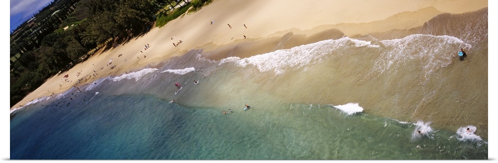 Long photo on canvas of ocean waves crashing on the shore of a Hawaiian beach.
