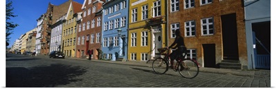 Woman riding a bicycle, Copenhagen, Denmark