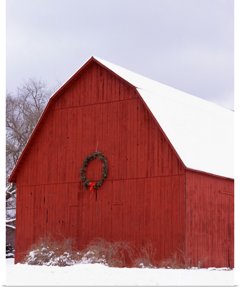 Big photo on canvas of a farm building decorated for Christmas in the snow.