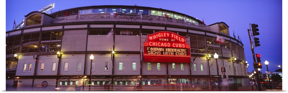 Panoramic photograph of the outer walls and sign of Wrigley Field where the Chicago Cubs play baseball, taken in the early...