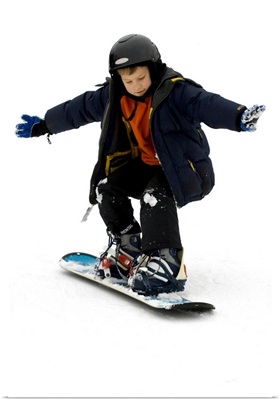 9 year old boy riding his snowboard