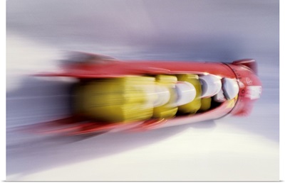 Blurred action of 4 man bobsled team