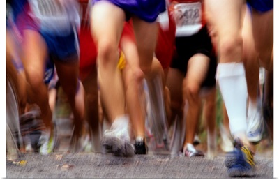 Blurred action of runner's legs competing in a race
