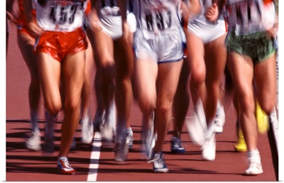 Blurred action of women runners during a track race