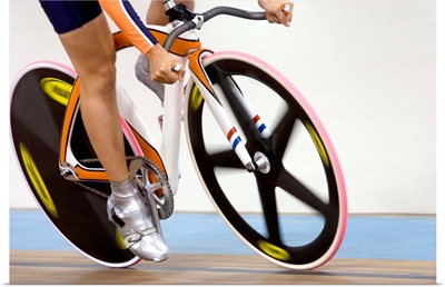 Detail of cyclist racing on the velodrome track