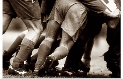 Detail of feet of a group of rugby players in a scrum