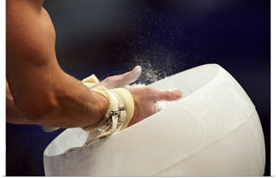 Detail of the hands of male gymnast preparing for competition
