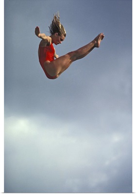 Female diver flying through the air