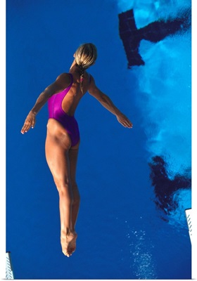 Female diver in action off the springboard