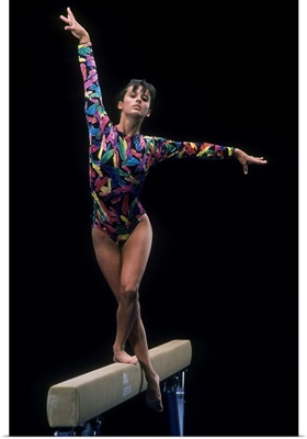 Female gymnast on the balance beam