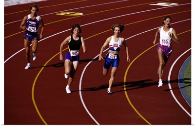 Female runners competing in a track race
