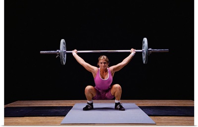 Female weightlifter in action