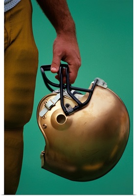 Football player holding his helmet