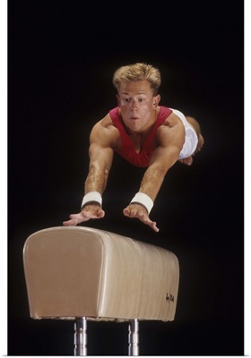 Male gymnast on the vault