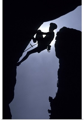 Silhouette of male rock climber