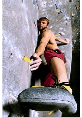 Wall climber placing his foot