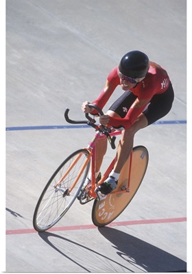 Woman cyclist competing on the velodrome