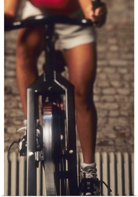 Woman exercising on a stationary bike