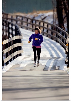 Woman out for a fitness run in winter
