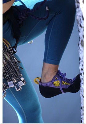 Woman rock climber shoe and legs