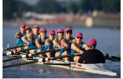 Womens eights rowing team in action