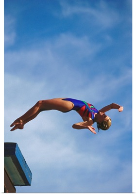 Young girl diving off the 10m platform