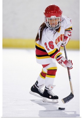 Young girl playing ice hockey