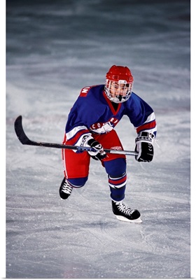 Young ice hockey player in action