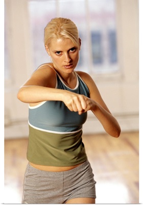 Young woman during exercise session in fitness studio