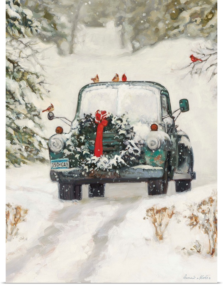 A truck with a Christmas wreath sitting in the snow in a forest.