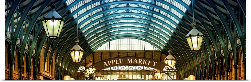 Panoramic image of the arches and hanging lamps in Covent Garden Market.