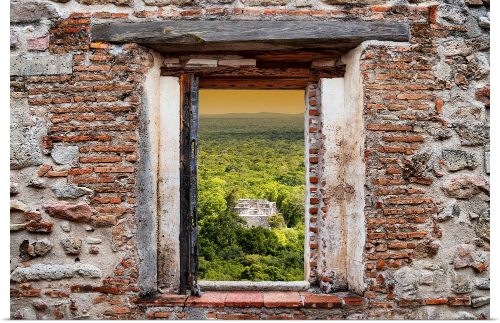 View of the sunset over the ancient Mayan City of Calakmul, Mexico, framed through a stony, brick window. From the Viva Me...