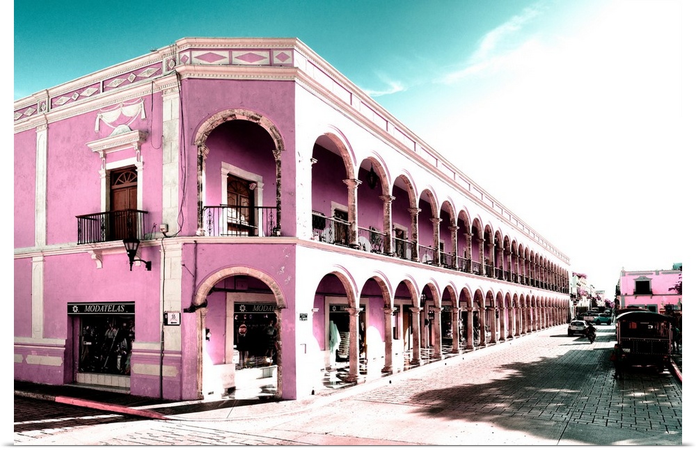 Photograph of a street view in Campeche, Mexico with pink architecture. From the Viva Mexico Collection.