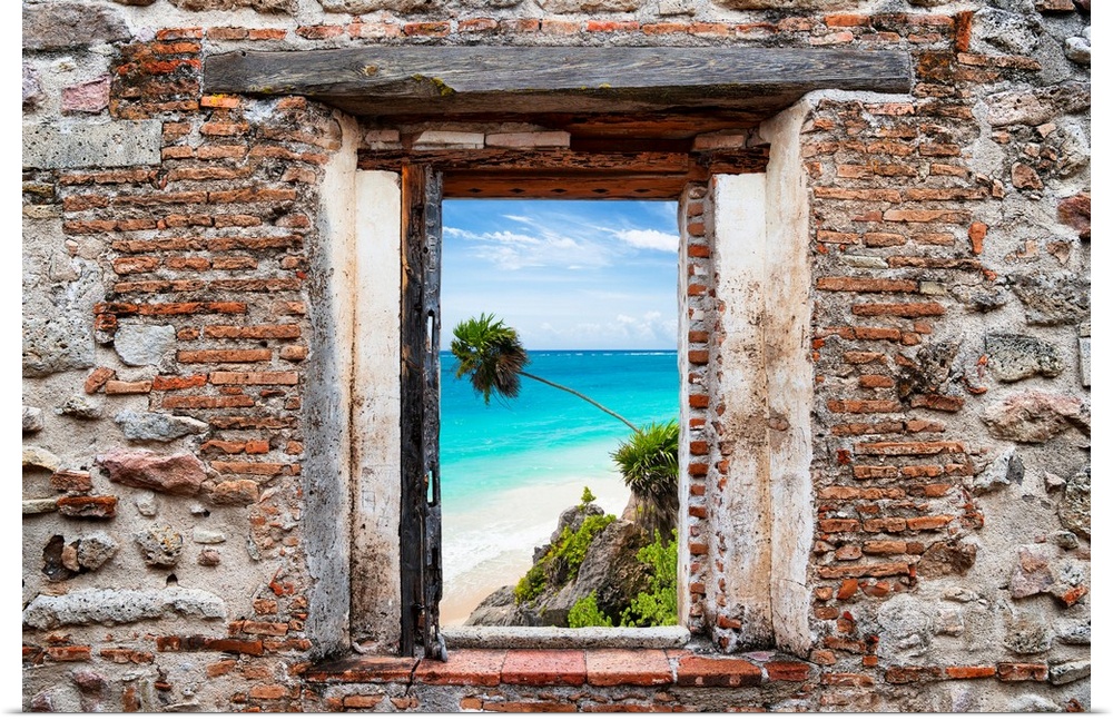 View of the Caribbean coastline framed through a stony, brick window. From the Viva Mexico Window View.