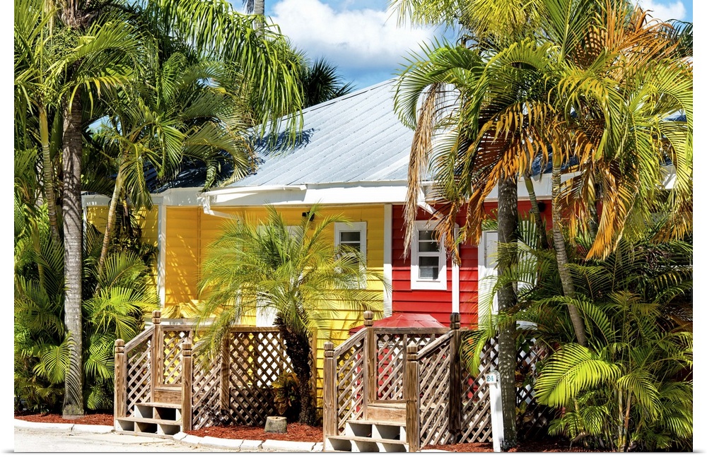 A brightly painted red and yellow house in a Key West neighborhood, Florida.