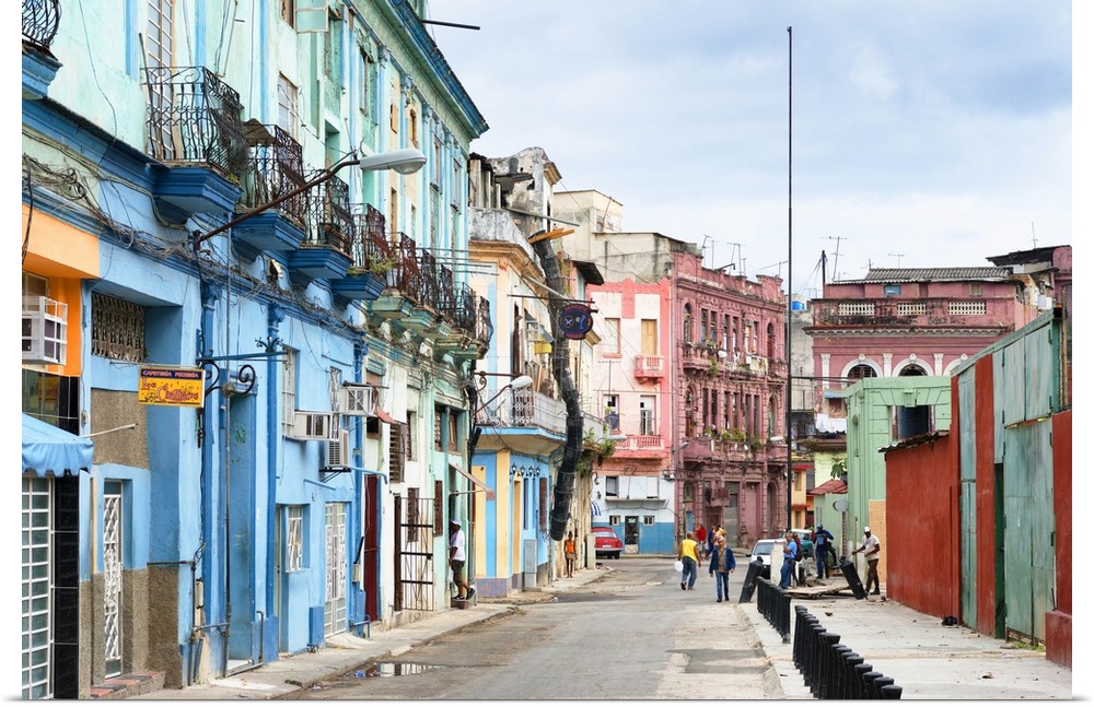 Photograph of a streetscape in Havana, Cuba, highlighting the colorful architecture.