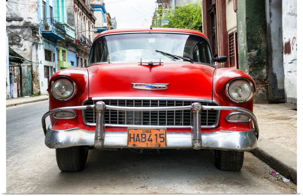 Photograph of the front of a red vintage Chevrolet.