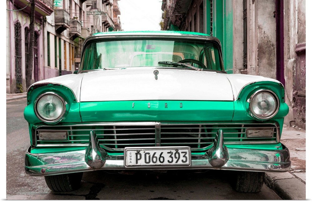 Photograph of a vintage green and white Ford parked in downtown Havana.