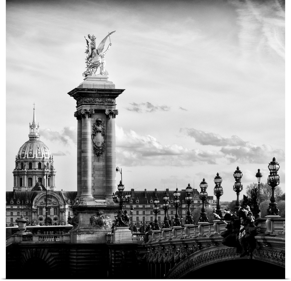 Black and white photo of a statue on the Pont Alexandre III in Paris, France.