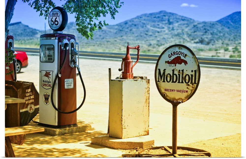 A vintage gas pump and a rusted sign for Mobiloil at a gas station on Route 66.