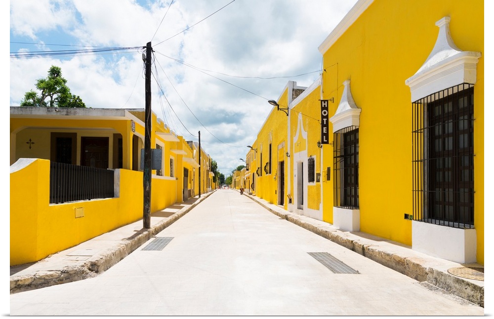 Street view photograph highlighting the yellow buildings in Izamal, Yucat?n, Mexico. From the Viva Mexico Collection.�